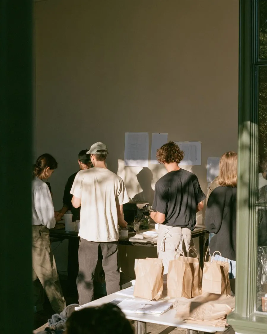 A small business team gathered at a work bench