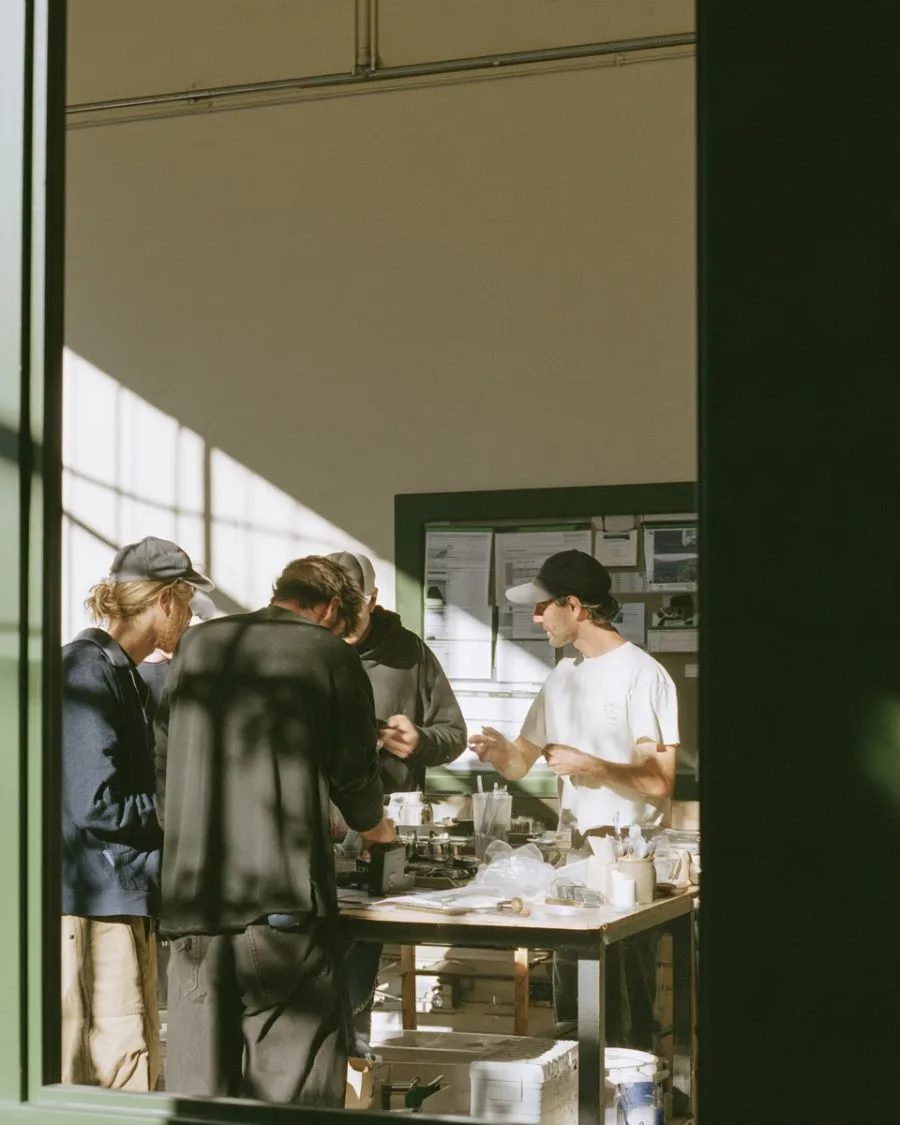 A small business crew working together at a bench